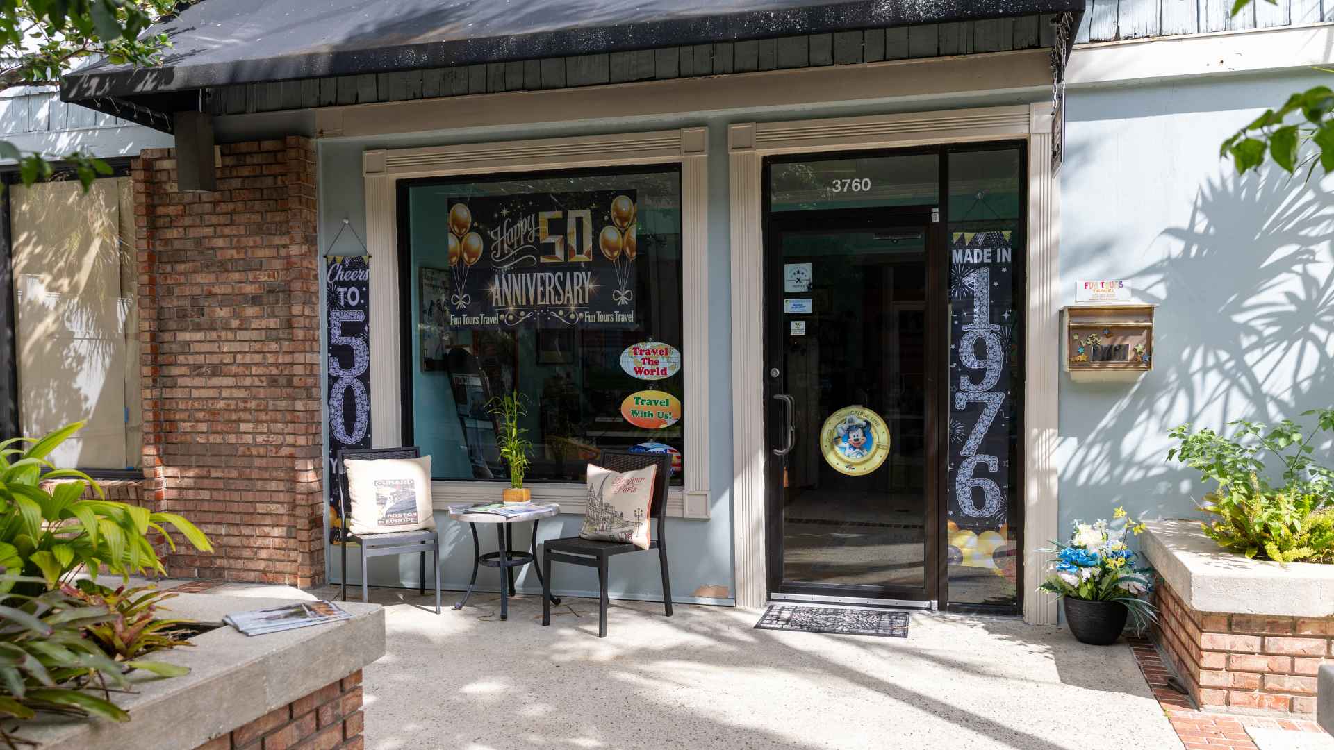 Fun Tours Travel storefront at 3760 SE Ocean Blvd, Stuart, FL decorated for the 50th anniversary